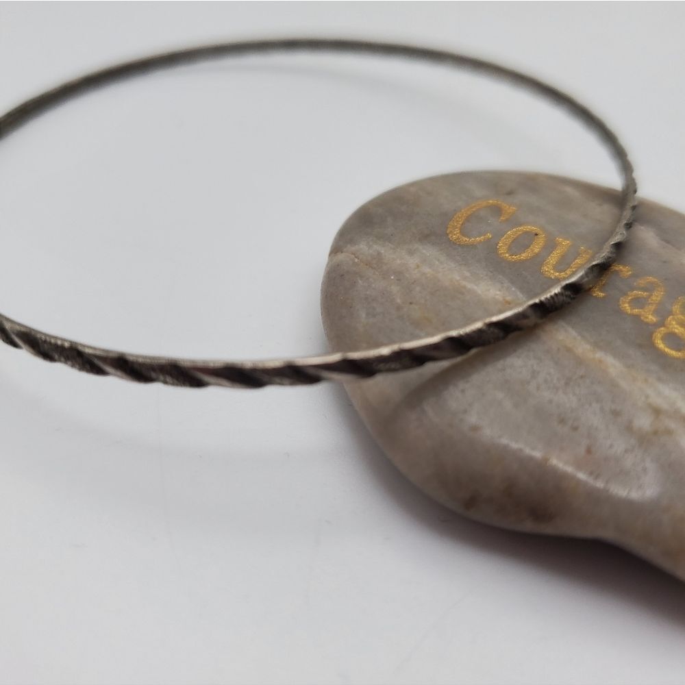 Silver toned carved‎ bracelet